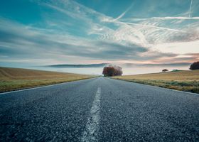 A country road in morning mist